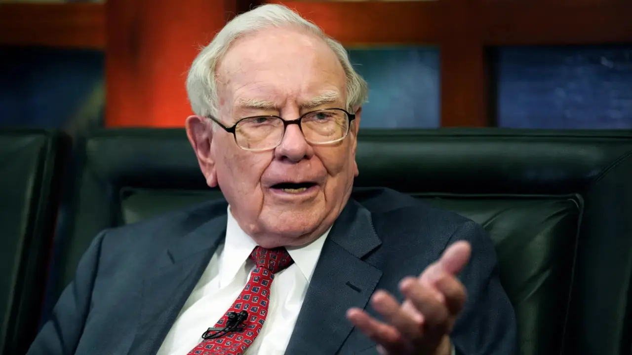 Calm investor reviewing stock market charts at a home desk during a market downturn
