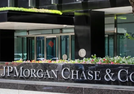 JPMorgan Chase headquarters building exterior with stock ticker graphic overlay
