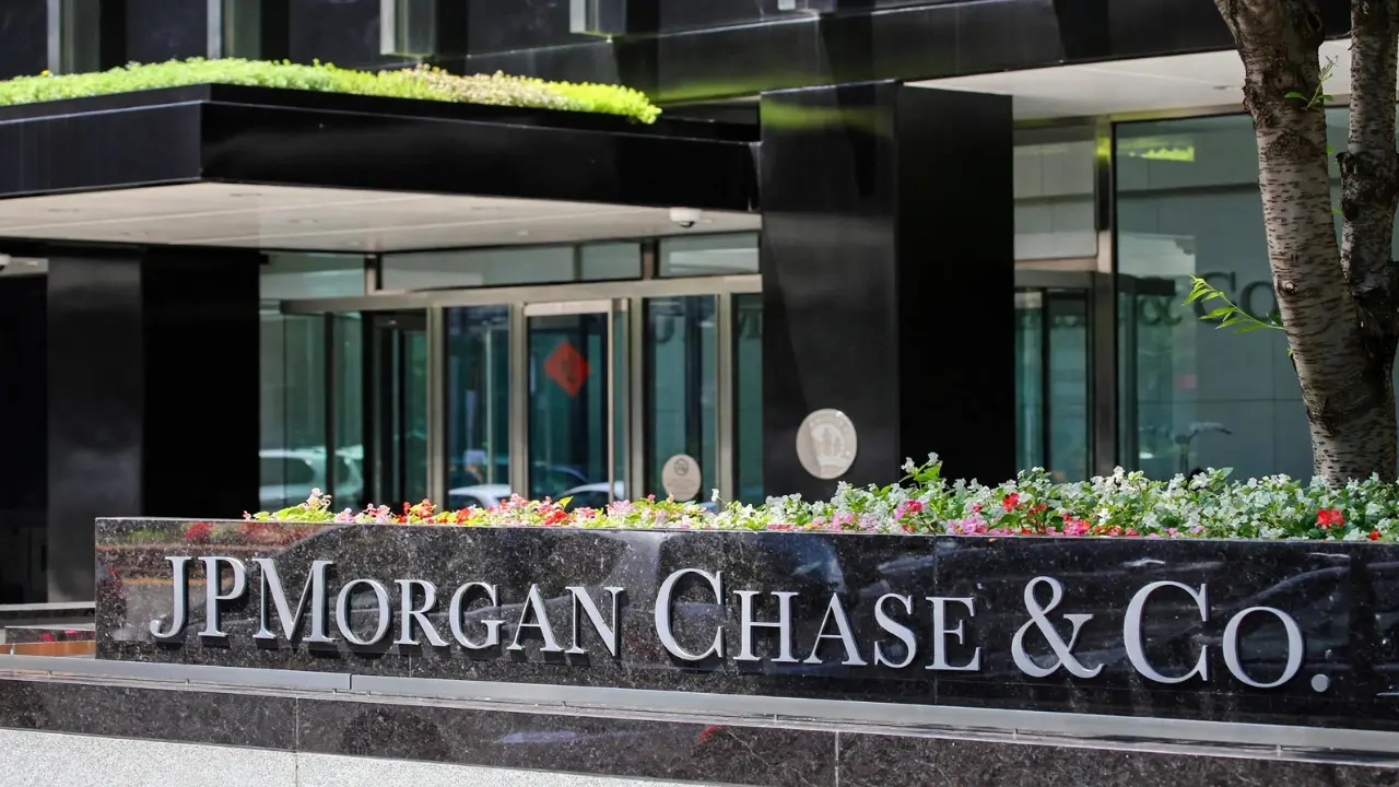 JPMorgan Chase headquarters building exterior with stock ticker graphic overlay