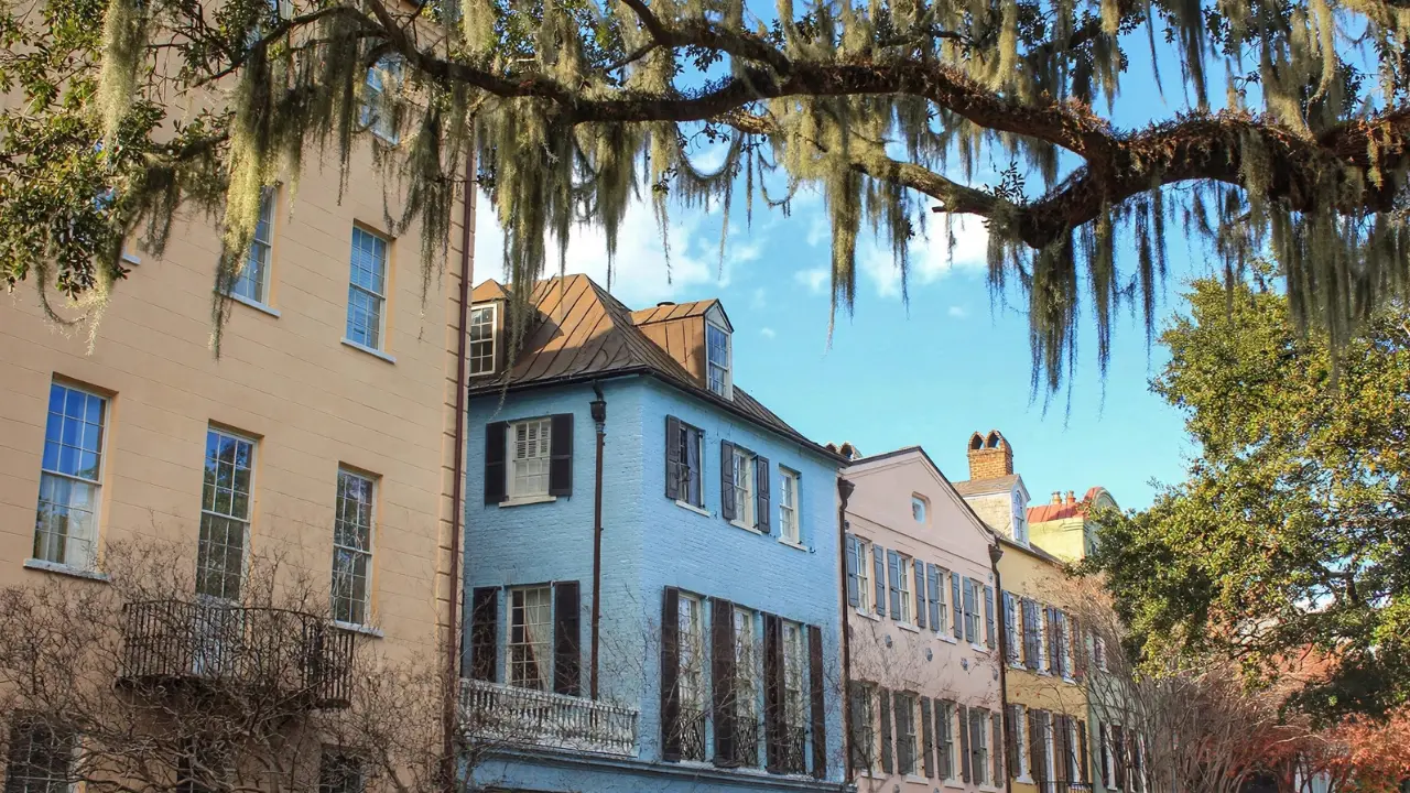 Colorful historic row houses in Charleston illustrating current mortgage rates and housing affordability.