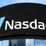 Stock market trading floor display showing a sharp rebound in the Nasdaq after Microsoft's earnings report