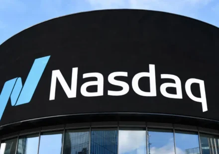 Stock market trading floor display showing a sharp rebound in the Nasdaq after Microsoft's earnings report