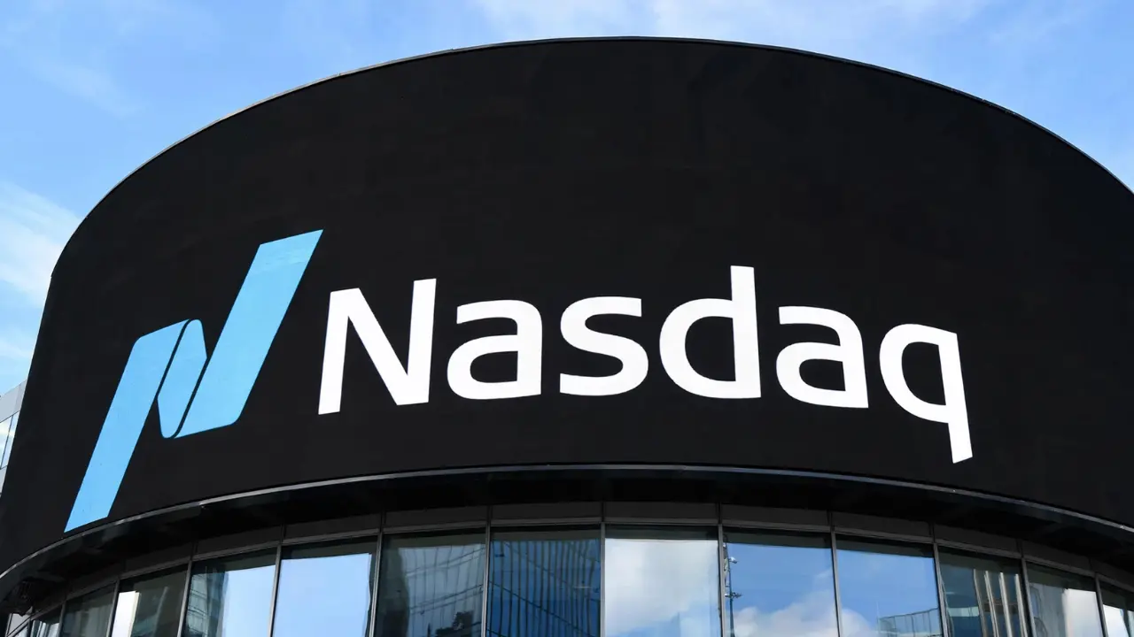Stock market trading floor display showing a sharp rebound in the Nasdaq after Microsoft's earnings report