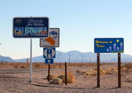 California and Texas highway signs illustrating a move between the states and potential RSU tax implications