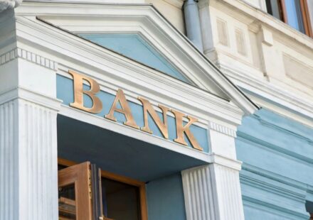 Commercial bank building entrance with federal regulatory examination seal