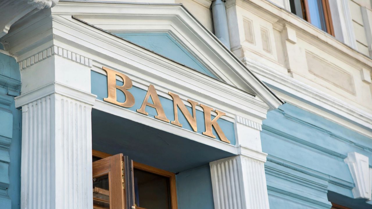 Commercial bank building entrance with federal regulatory examination seal