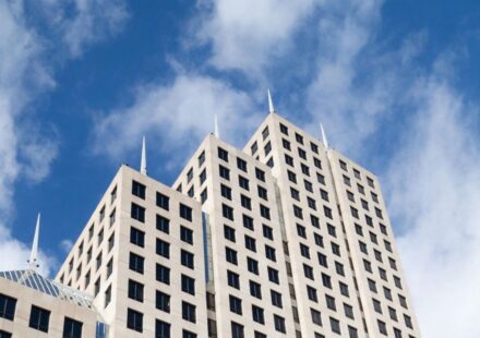 Bank office building under a blue sky illustrating Florida banking changes in 2026