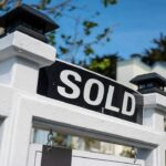 Sold home sign representing New York mortgage rates and homebuying costs