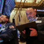 An investor checking stock portfolio updates and bond fund yields on a trading mobile application