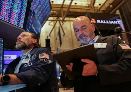 An investor checking stock portfolio updates and bond fund yields on a trading mobile application